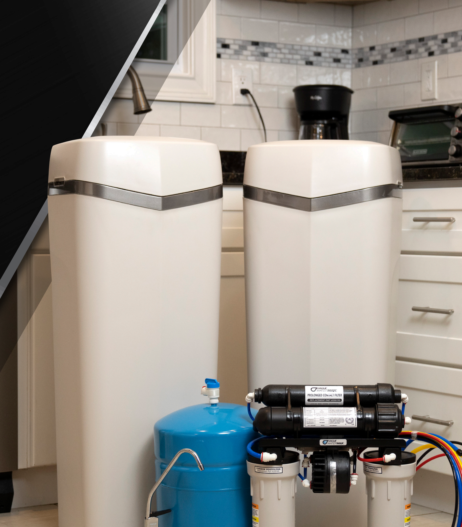 Hague WaterMax water softener and reverse osmosis system installed in a kitchen — a complete whole-home water treatment solution