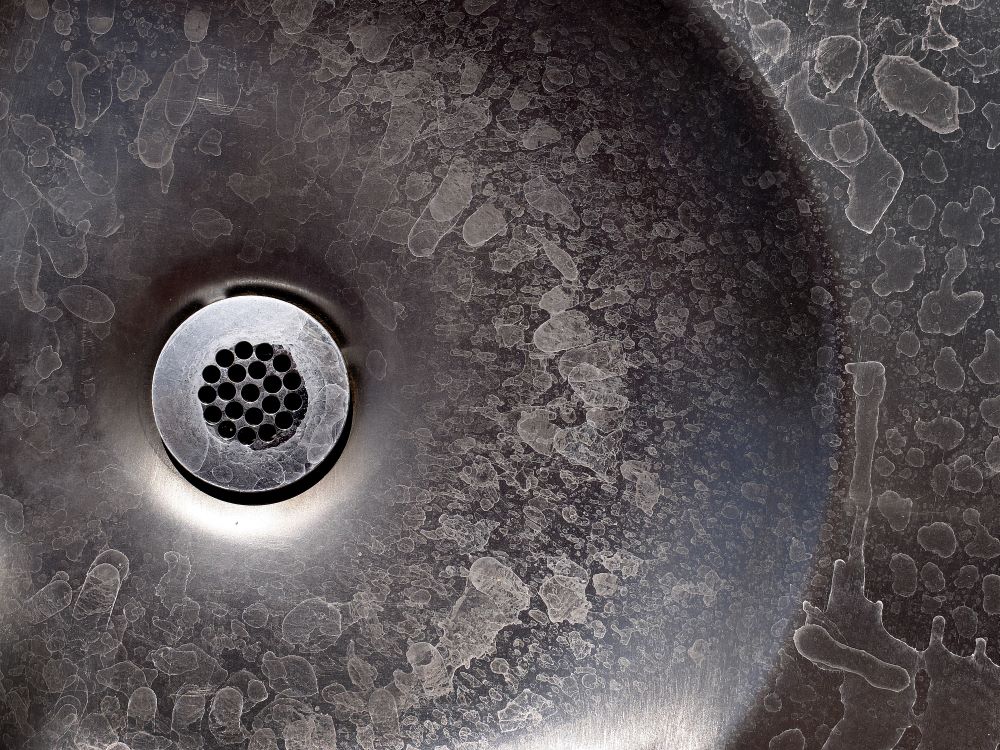 water softener systems - hard water spots on drain